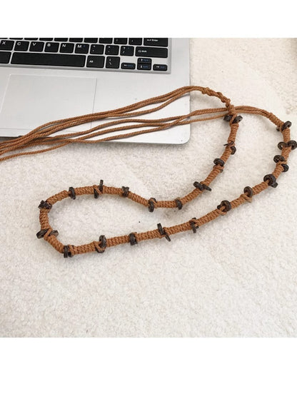 Beco rope belt tied in a knot around a waist on a white background