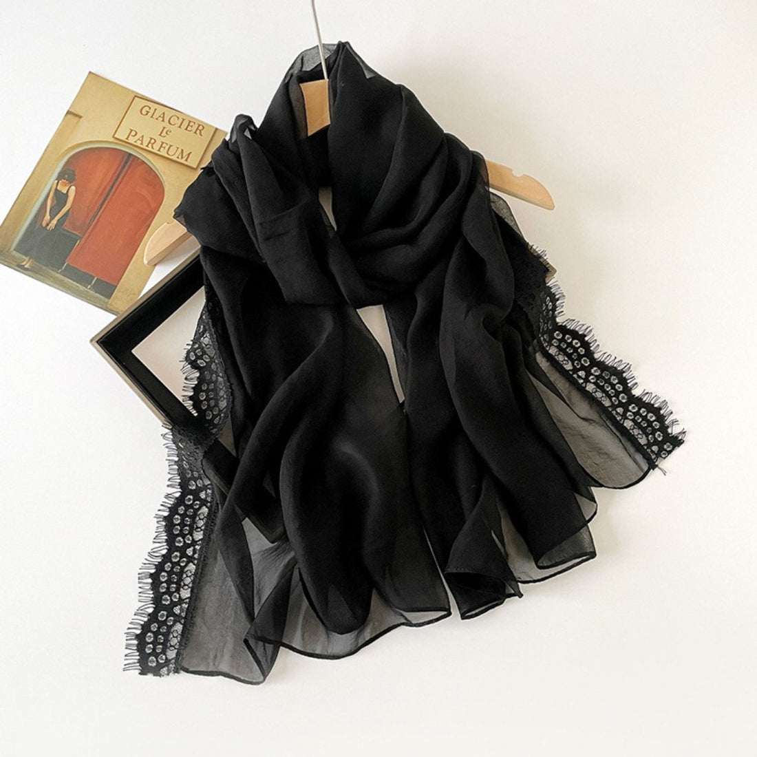 Close-up of intricate lace border detail on a lightweight scarf