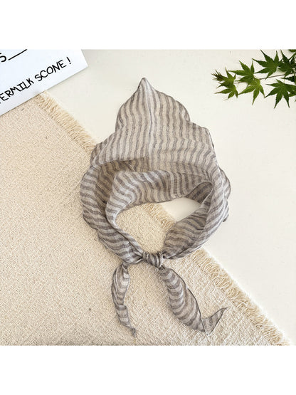 Folded soft textured stripe head scarf showing fabric texture and pattern
