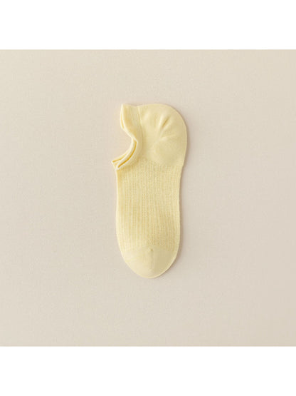 Beige liner sock stretched to show fabric texture and elasticity