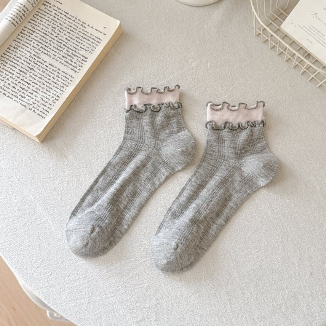 Model wearing Rufia Sweet Ruffle Edge Crew Socks with ruffle trim and casual shoes
