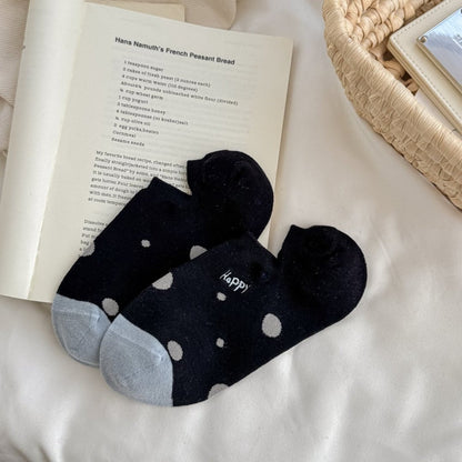 Stack of Rufia Happy Dot No Show Socks in various colors with polka dot patterns