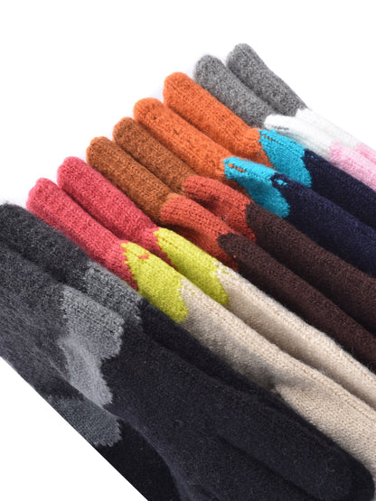 Model wearing knitting patchwork touchscreen gloves outdoors