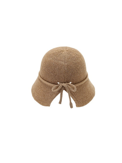 Haila woven bucket hat with tie back detail displayed at an angle