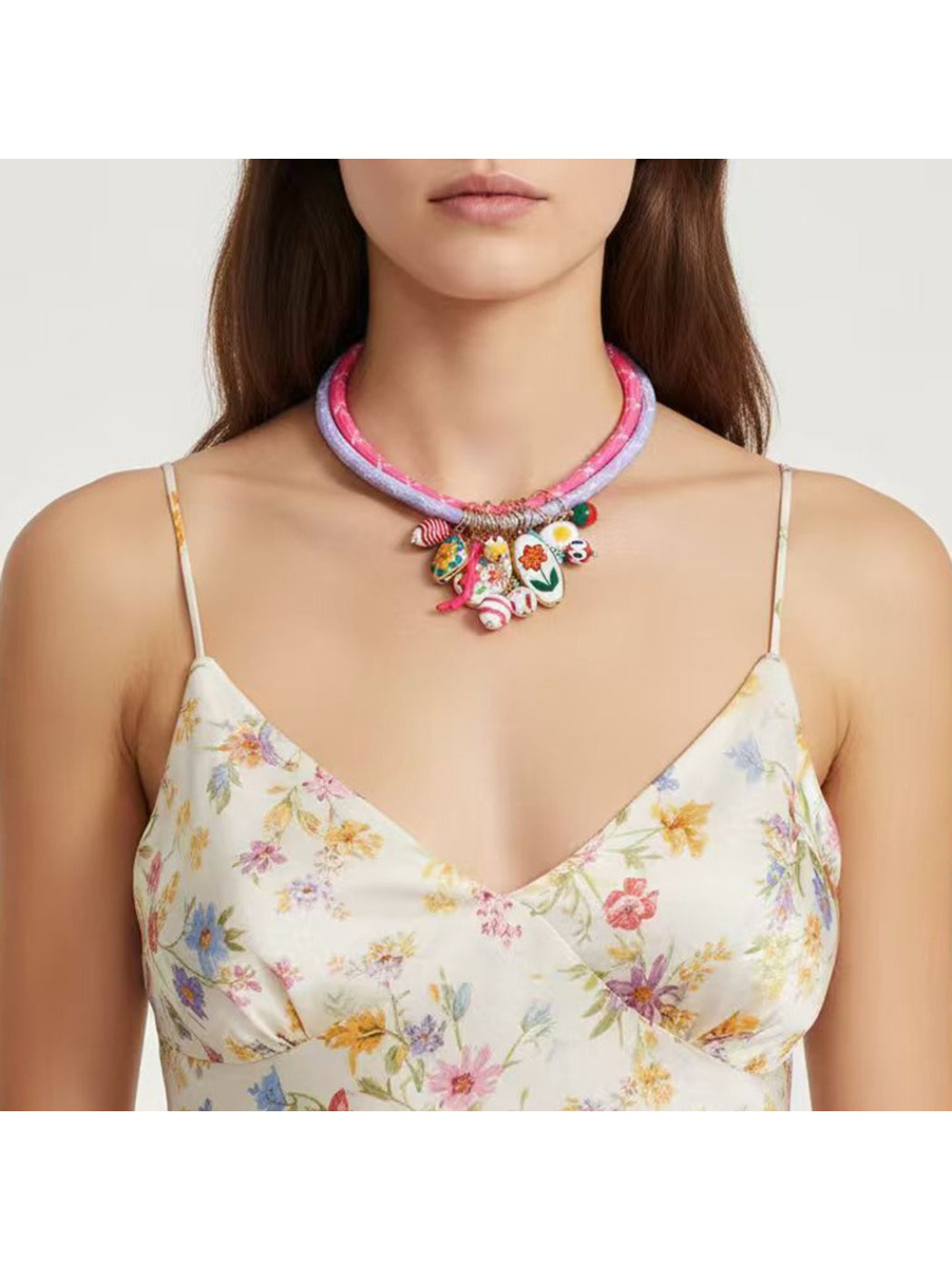 Close-up of Neckit Charm Cluster Necklace showing detailed charm design on rope chain