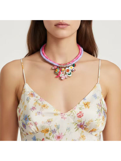 Close-up of Neckit Charm Cluster Necklace showing detailed charm design on rope chain