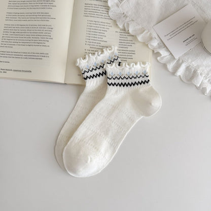 Model wearing Rufia Sweet Frill Cuff Crew Socks styled with casual shoes