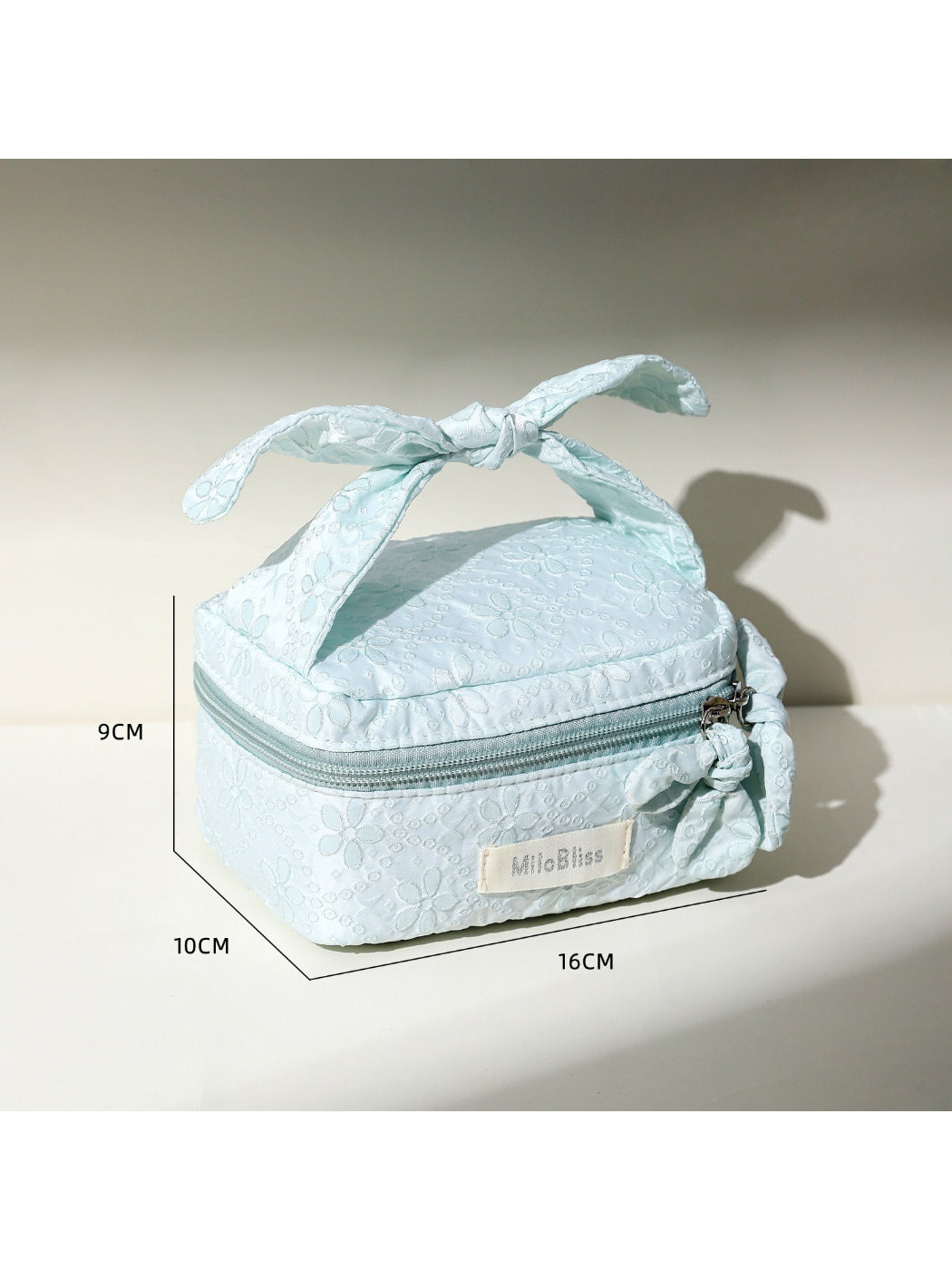 Cosbai Bow Top Handle Makeup Case angled view highlighting the bow and handle