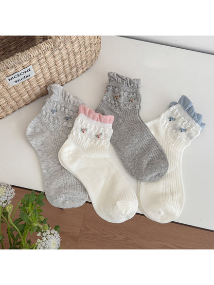 Pair of Rufia soft floral detail ribbed crew socks in light beige color