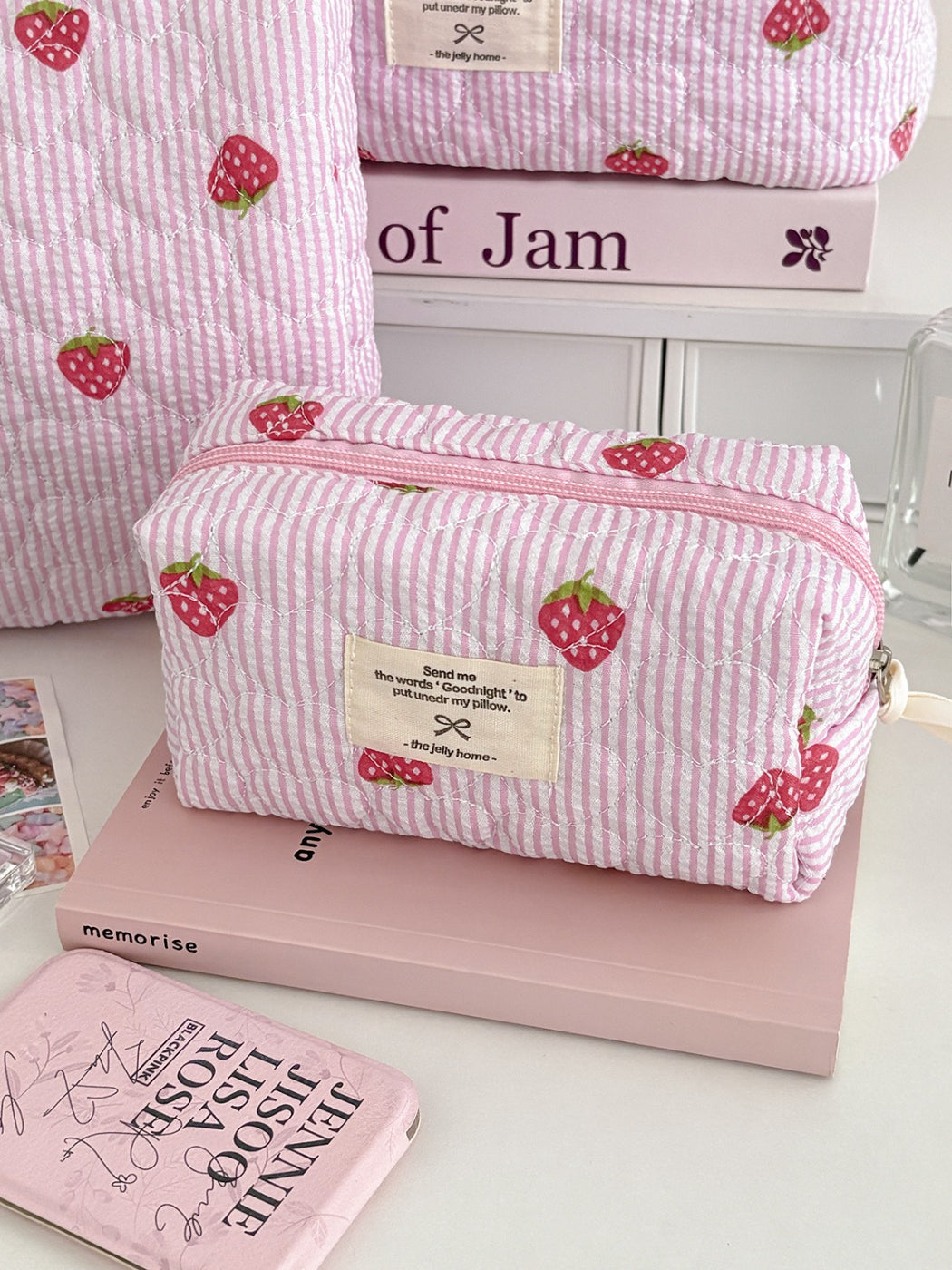 Open view of Cosbai Strawberry Stripe Quilted Travel Makeup Bag showing interior