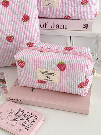 Open view of Cosbai Strawberry Stripe Quilted Travel Makeup Bag showing interior