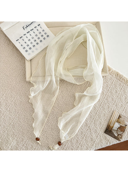 Model styling soft pleated sheer skinny scarf with casual outfit