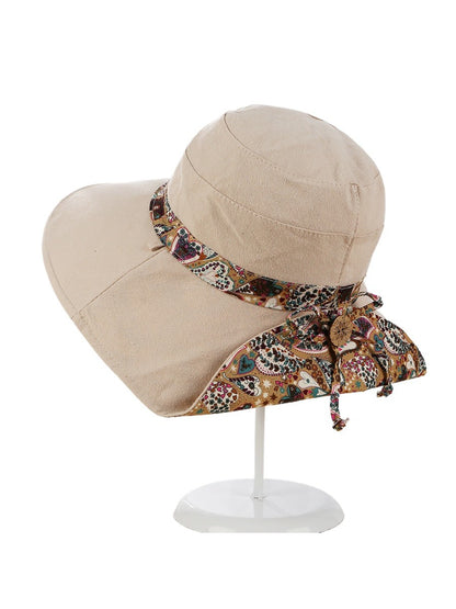 Top view of the Haila sun hat showing the woven texture and ribbon detail