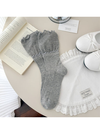 Rufia scallop edge lace crew socks styled with a skirt