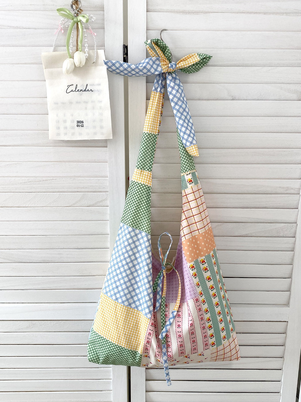 Side view of Cosbai boho sling tote bag highlighting its spacious interior