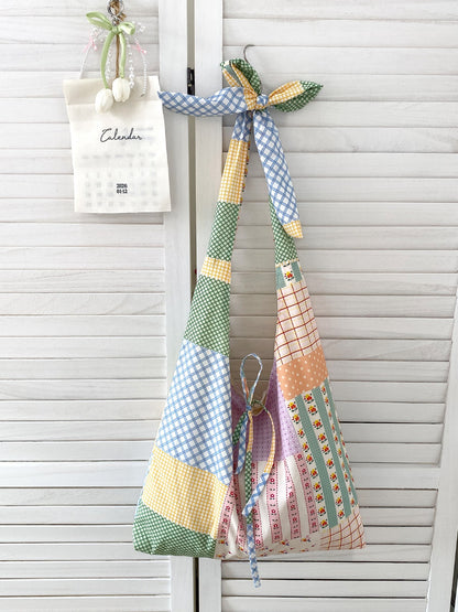 Side view of Cosbai boho sling tote bag highlighting its spacious interior