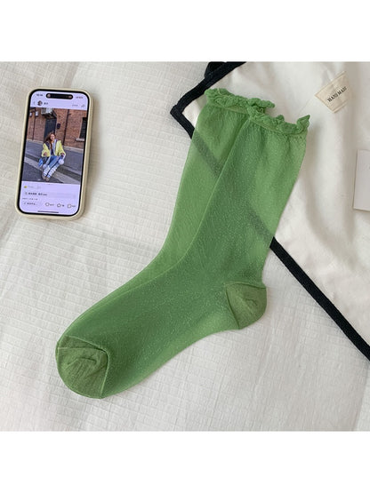 Rufia soft sparkle crew socks paired with casual sneakers outdoors