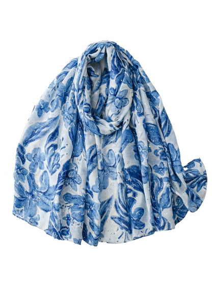 Close-up of Scarvii floral print scarf showing detailed flower patterns and fabric texture