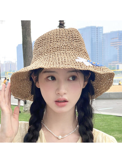 Haila Coastal Bloom straw look hat displayed on white background