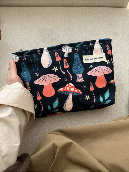 Cosbai cosmetic bag open, displaying interior lining and mushroom pattern exterior