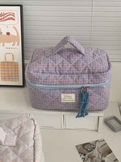 Close-up of Cosbai Puffy Check Travel Makeup Bag showing textured check design
