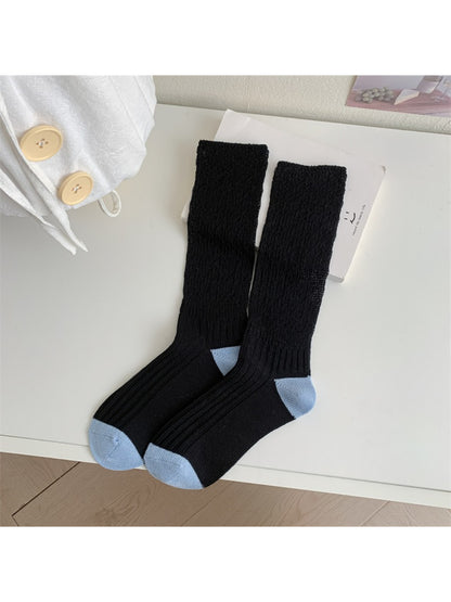 Multiple pairs of Rufia crew socks in various colors with contrast toe detail