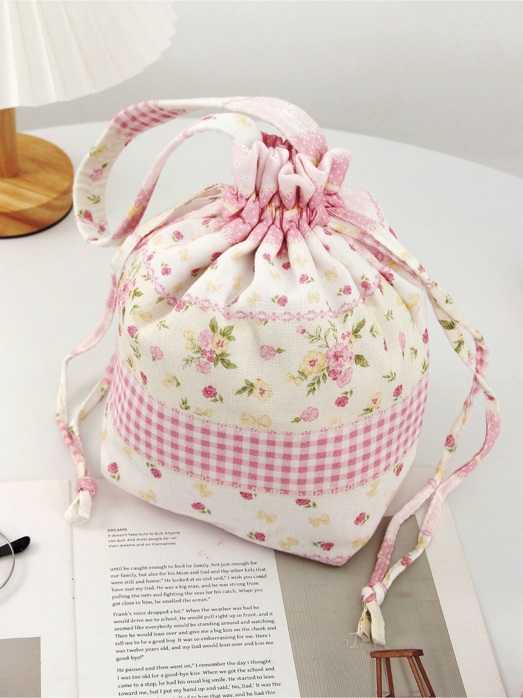 Cosbai soft floral drawstring handbag displayed upright with drawstring pulled