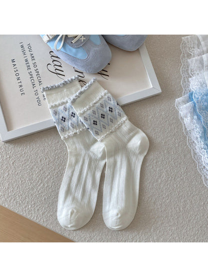 Lifestyle image of Rufia crew socks worn with casual shoes outdoors