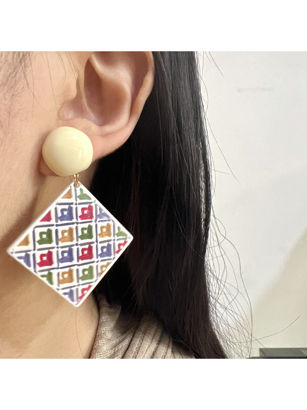 Side view of Earwish geometric diamond drop earrings showing the drop design