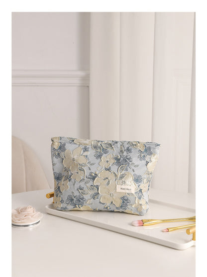 Cosbai floral cosmetic bag displayed with matching floral accessories