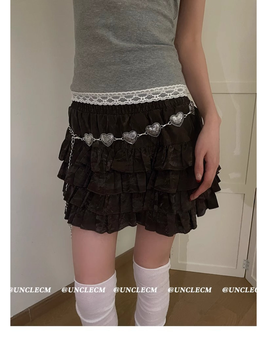 Beco Heart Chain Waist Belt styled over a black dress on a mannequin