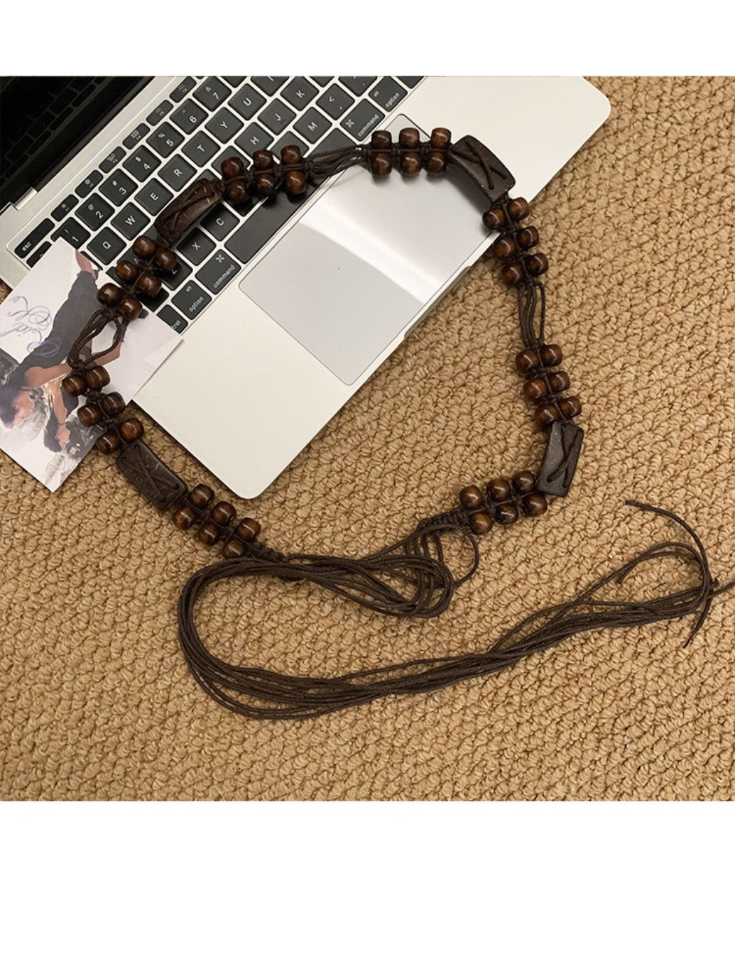 Beco brown beaded tie waist belt tied in a bow on a mannequin waist