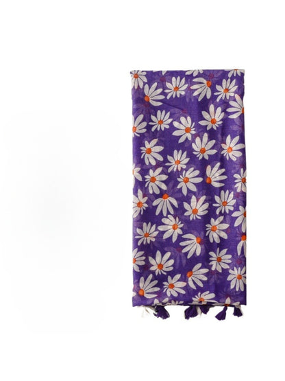 Close-up of Scarvii wrap fabric with tiny bloom floral print and tassel detail