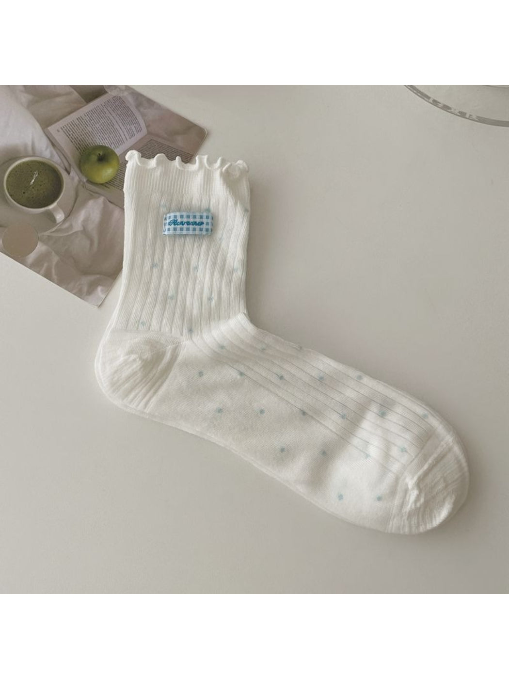 Rufia socks folded neatly with visible contrast stitching