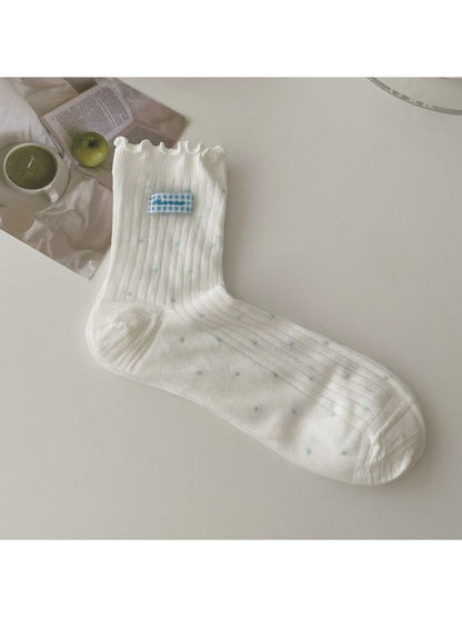 Rufia socks folded neatly with visible contrast stitching