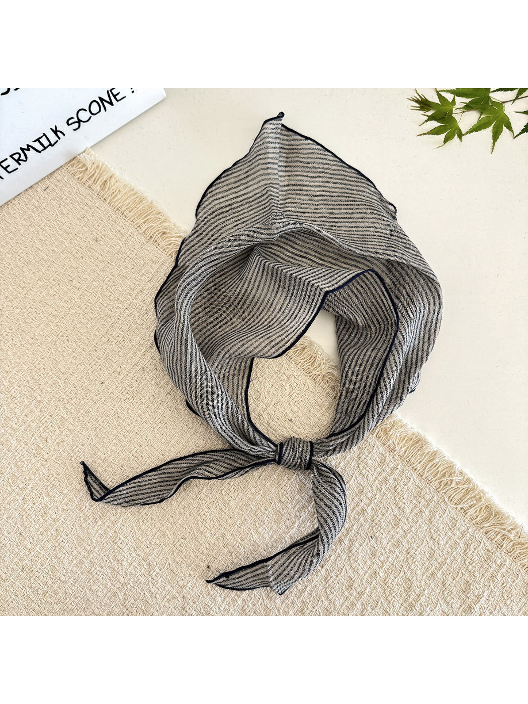 Model wearing the soft textured stripe head scarf wrapped around the head