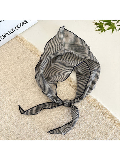 Model wearing the soft textured stripe head scarf wrapped around the head