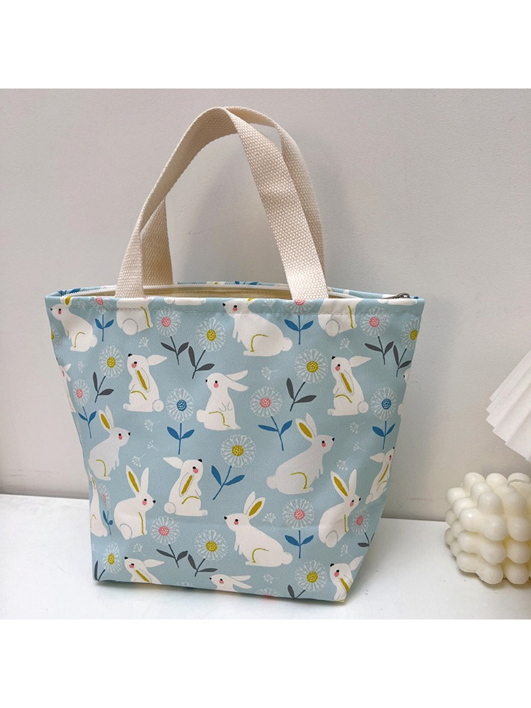 Cosbai lunch tote bag featuring various animal faces in bright colors