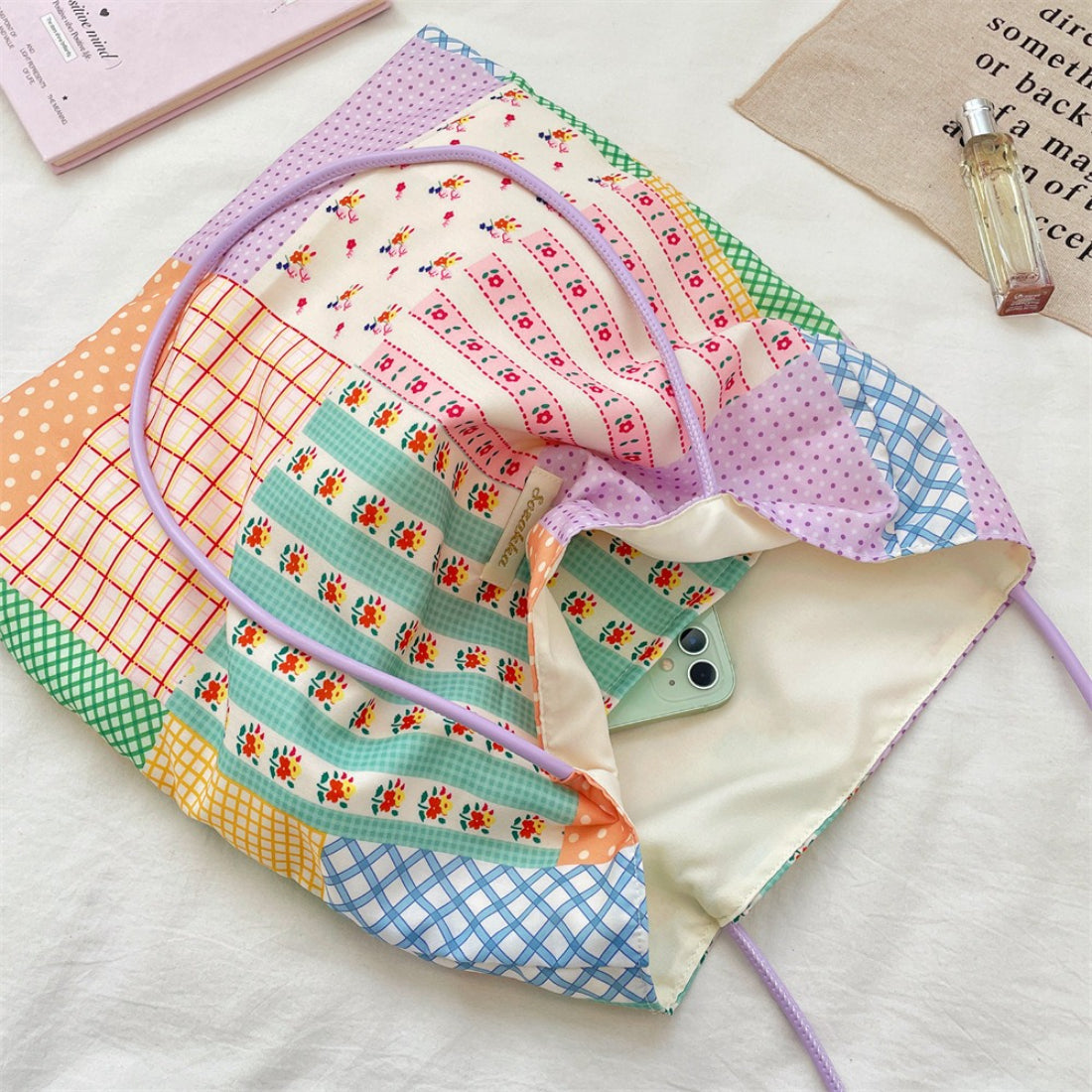 Side view of Cosbai patchwork tote bag highlighting fabric texture and stitching