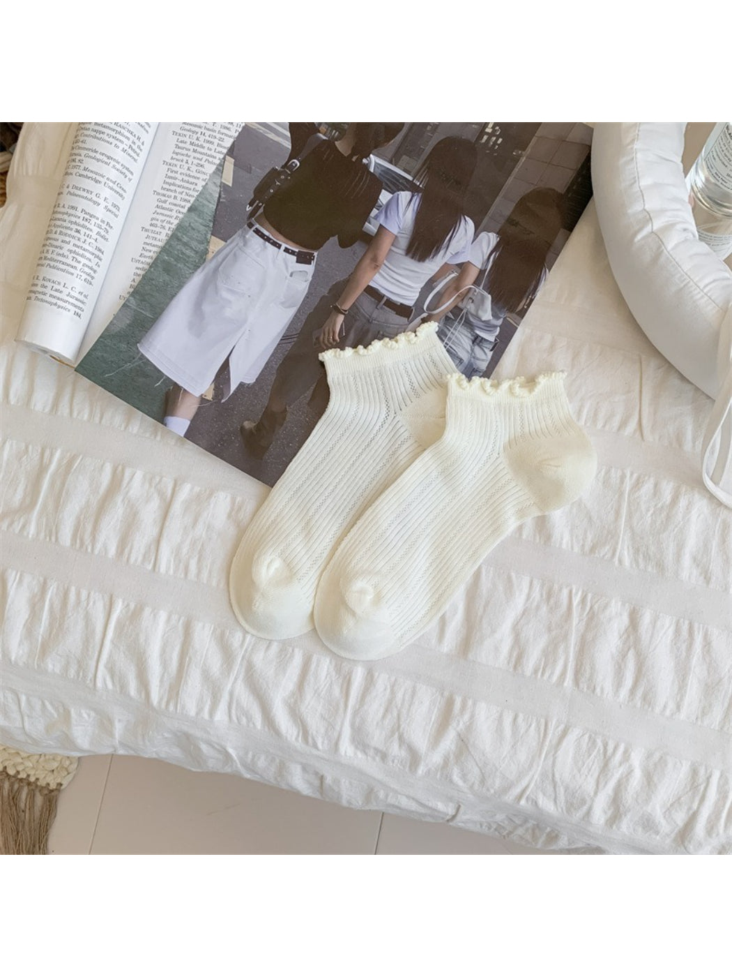 Rufia ankle socks folded to show texture and bobble trim edging