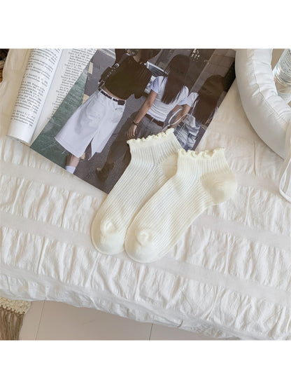 Rufia ankle socks folded to show texture and bobble trim edging