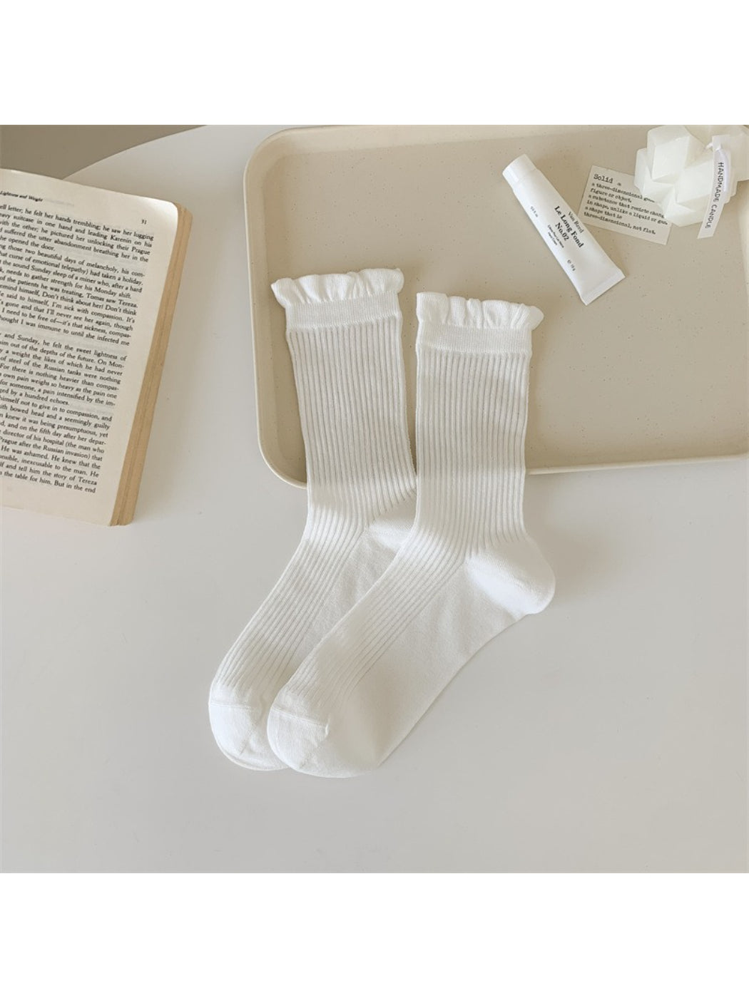Side view of Rufia Everyday Ruffle Cuff Crew Socks showing ribbed texture