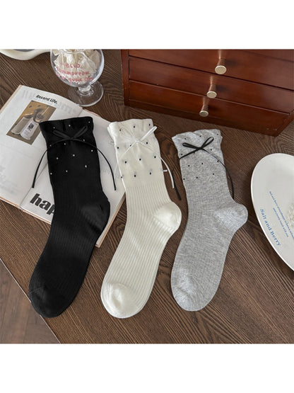 Rufia soft ribbed bow crew socks worn on feet with casual shoes