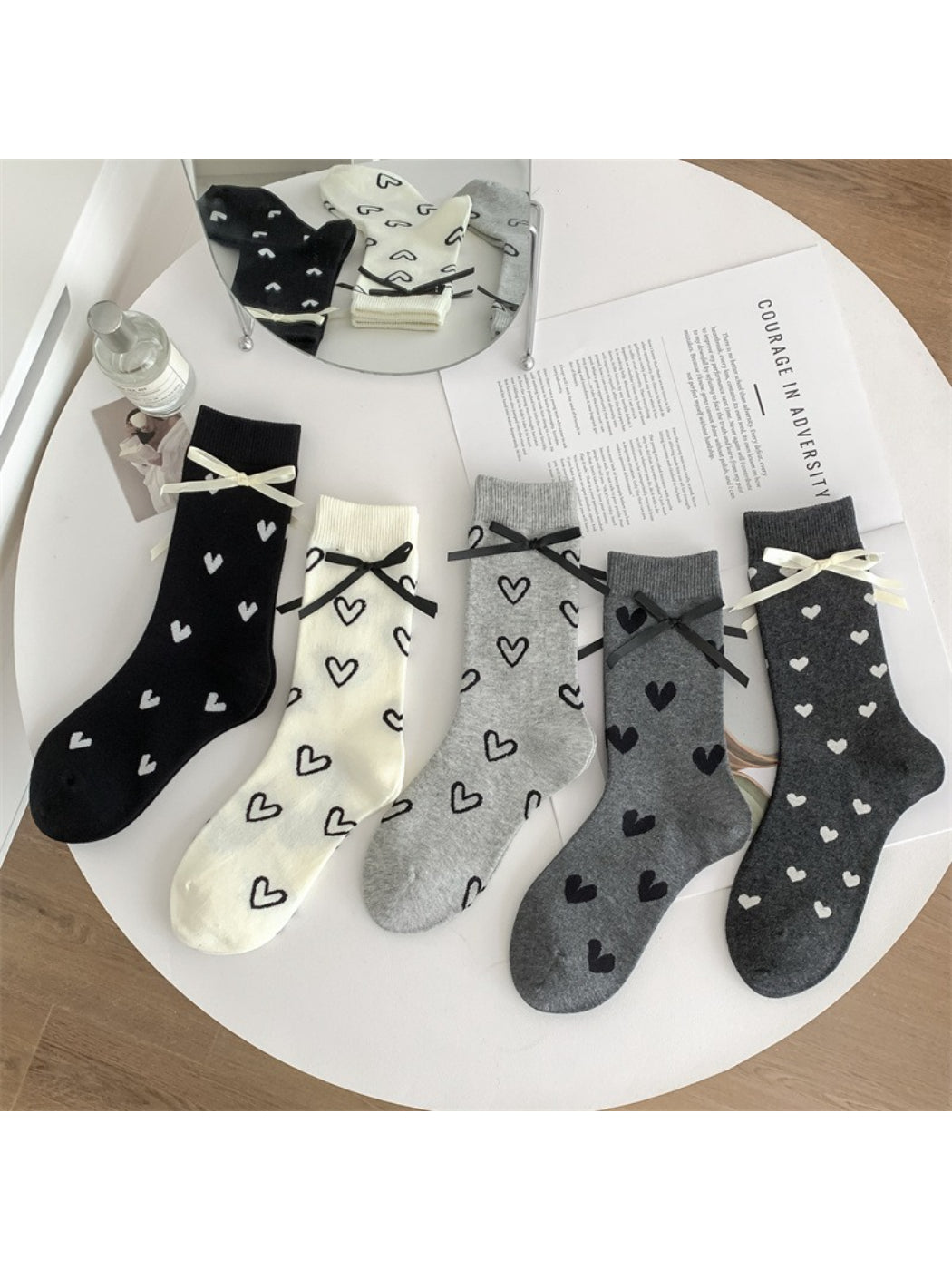 Pair of Rufia soft crew socks with red heart pattern on white background