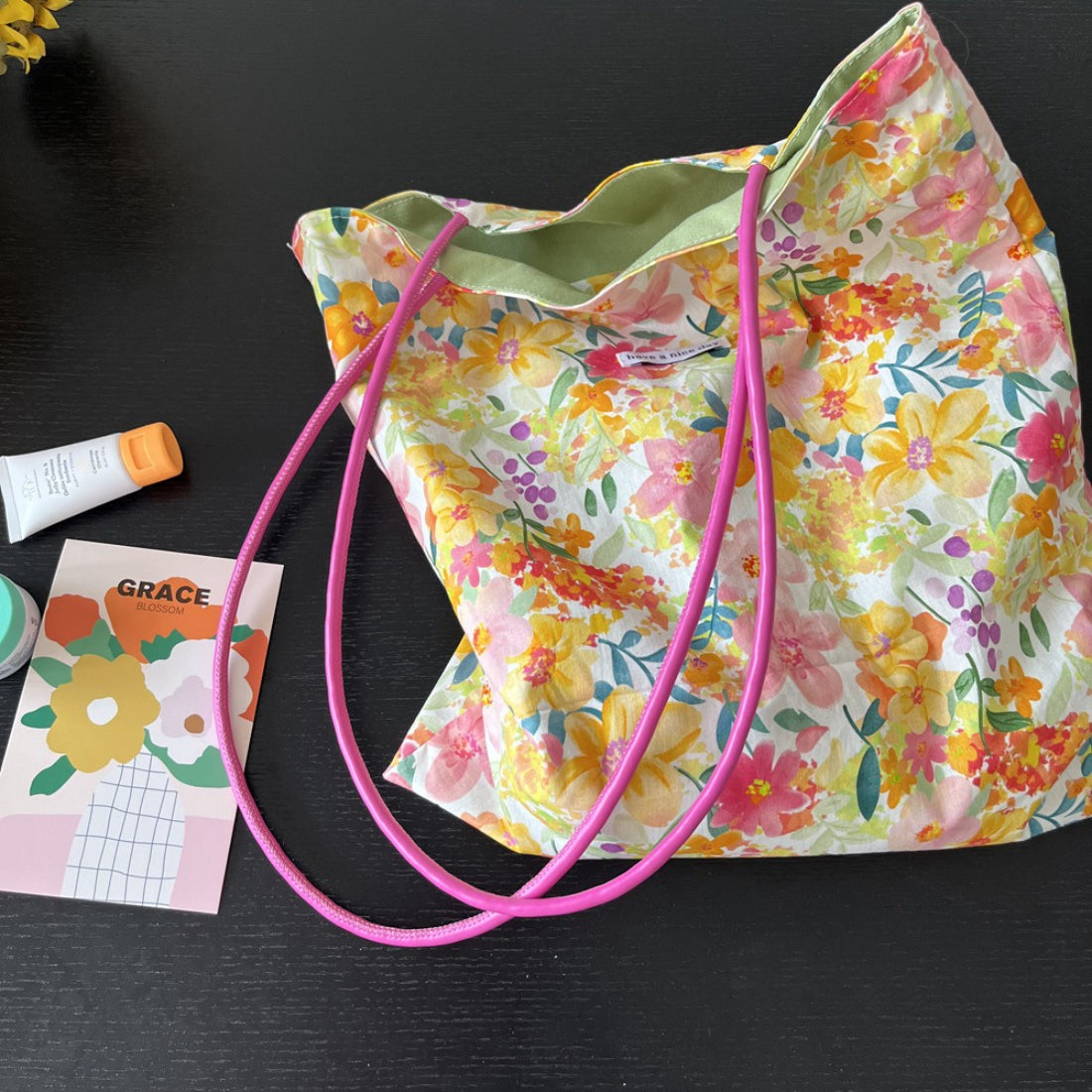 Cosbai pink strap tote bag with floral print on white background