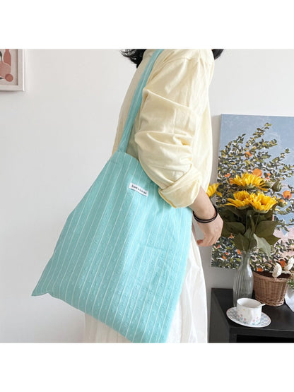Cosbai tote bag open showing spacious interior and light lining