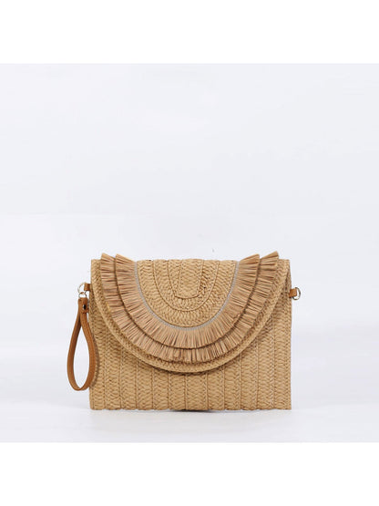 Cosbai clutch bag with tassels hanging, showing detailed weave and colors