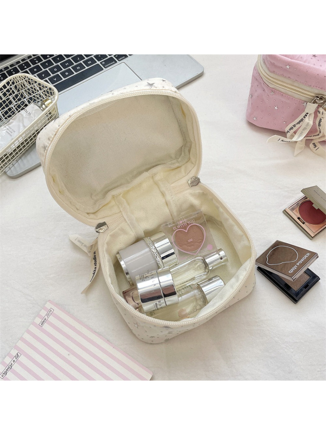 Cosbai star print cosmetic makeup bag photographed on a plain surface