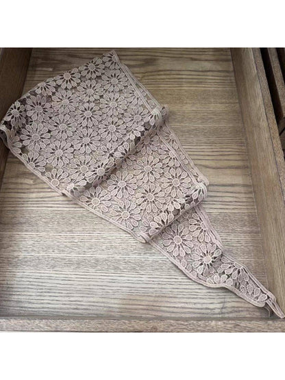 Flat lay of white crochet lace head scarf bandana showing full design