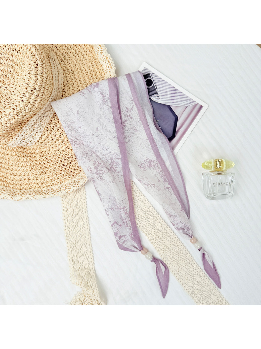 Side view of the scarf showing the lightweight fabric and bead embellishments